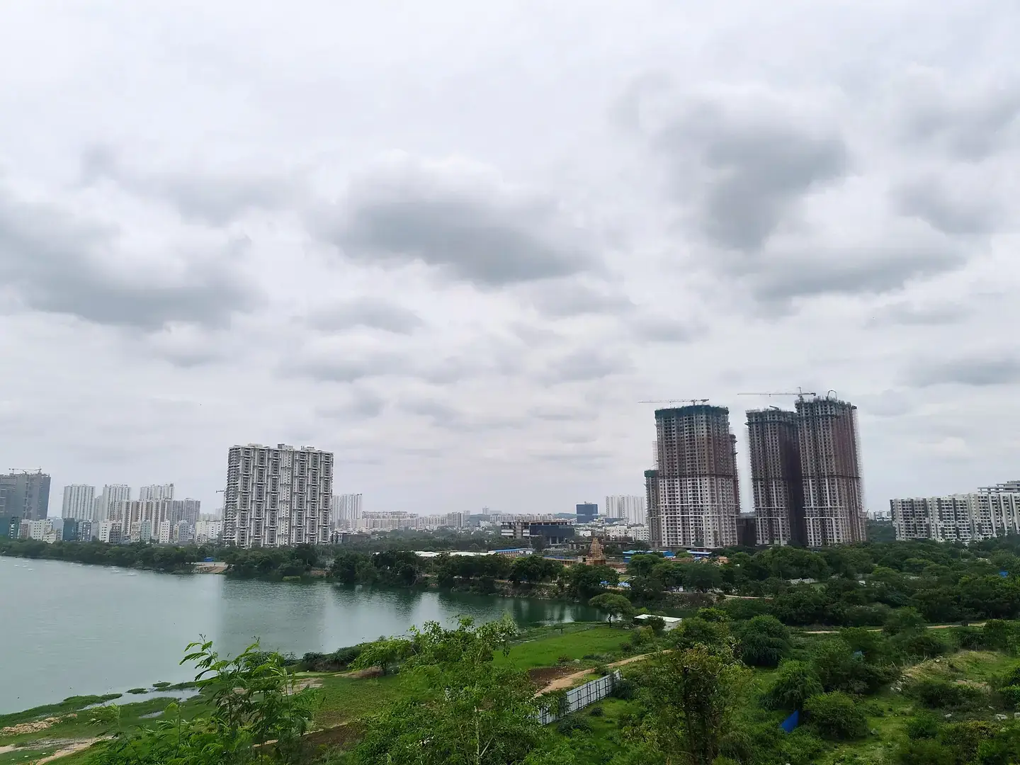 Kokapet Lake with new residential towers on the far bank